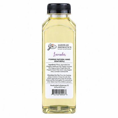 A clear plastic bottle of Jarhead Aromatics Lavender Handmade Foaming Natural Hand Soap, featuring a black cap and a white label with ingredients, directions, and a barcode.