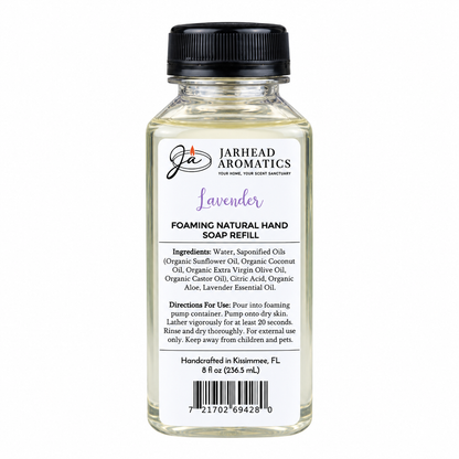 A clear plastic bottle of Jarhead Aromatics Lavender Handmade Foaming Natural Hand Soap refill, featuring a black cap and a white label detailing ingredients and usage instructions.