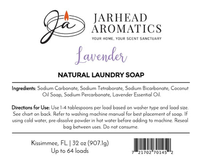 Jarhead Aromatics Lavender Handmade Natural Laundry Soap features a label with ingredients, directions, and usage details. This powdered detergent, made with lavender essential oil, has black and purple text on a white background, along with a flame logo and barcode at the bottom right. Ideal for anyone seeking a natural laundry soap infused with the calming scent of lavender.