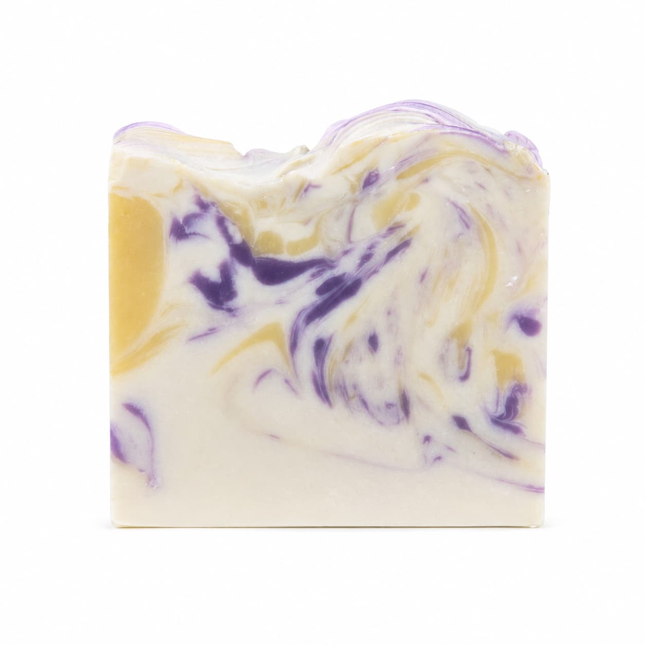 A rectangular bar of Jarhead Aromatics’ Lavender + Lemon Handmade Coconut Milk Artisan Soap—featuring a marbled pattern in white, yellow, and purple tones evocative of calming lavender and bright lemon—is displayed against a plain white background.