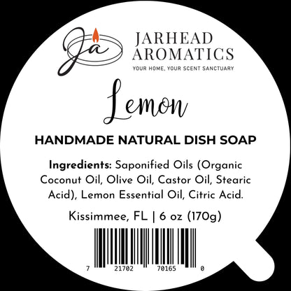 Round soap label for Jarhead Aromatics Lemon Handmade Natural Solid Dish Soap | Citrus Kitchen Cleaning Bar with Lemon Essential Oil, featuring a plant-based formula crafted with coconut oil, olive oil, castor oil, lemon essential oil, and citric acid. Includes weight (6 oz) and barcode.