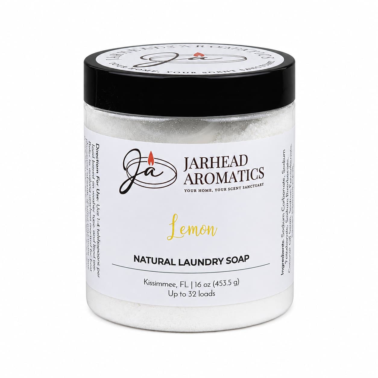 A clear jar labeled Jarhead Aromatics Lemon Handmade Natural Laundry Soap, topped with a black lid. Inside is powdered detergent made by hand and scented with fresh lemon essential oil. The 16 oz jar provides enough for up to 32 loads.