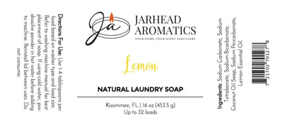 White label for Jarhead Aromatics Lemon Handmade Natural Laundry Soap | Powdered Detergent with Lemon Essential Oil. This handmade powdered detergent is crafted with natural laundry soap and infused with pure lemon essential oil for a fresh, clean experience. Includes directions, ingredients, barcode, and the text: “Kissimmee, FL 16 oz (453.5 g) Up to 32 loads.” Logo and lemon graphic are displayed.
