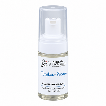A travel-size bottle of Maritime Escape Handmade Foaming Hand Soap | Ozone, Sea Salt & Violet with a clear pump dispenser.