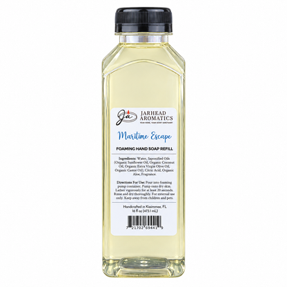 A tall, rectangular bottle of clear Maritime Escape Handmade Foaming Hand Soap | Ozone, Sea Salt & Violet refill, featuring a black cap and a white label with product details, ingredients, directions, and a barcode.