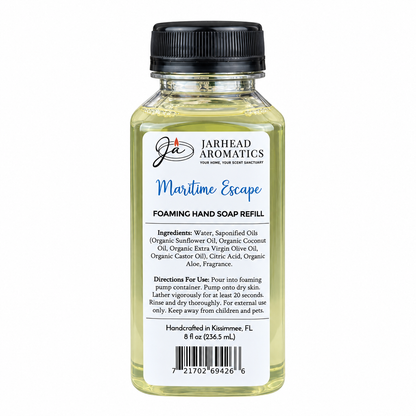 A clear plastic bottle of Maritime Escape Handmade Foaming Hand Soap | Ozone, Sea Salt & Violet refill with a black cap and a white label detailing ingredients and directions.