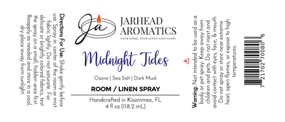 The Jarhead Aromatics “Midnight Tides” Room & Linen Spray features a candle logo, directions, warning, and scent notes of sea salt, dark musk, and sandalwood—a coastal home fragrance in a 4 fl oz (118.2 mL) bottle.
