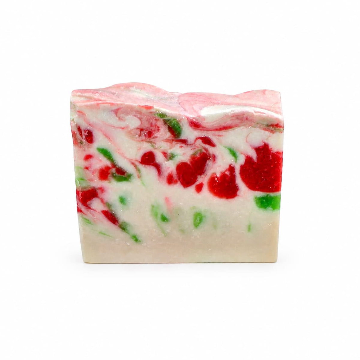 Rectangular bar of Mistletoe Handmade Artisan Soap with a white base and swirling patterns of red and green.