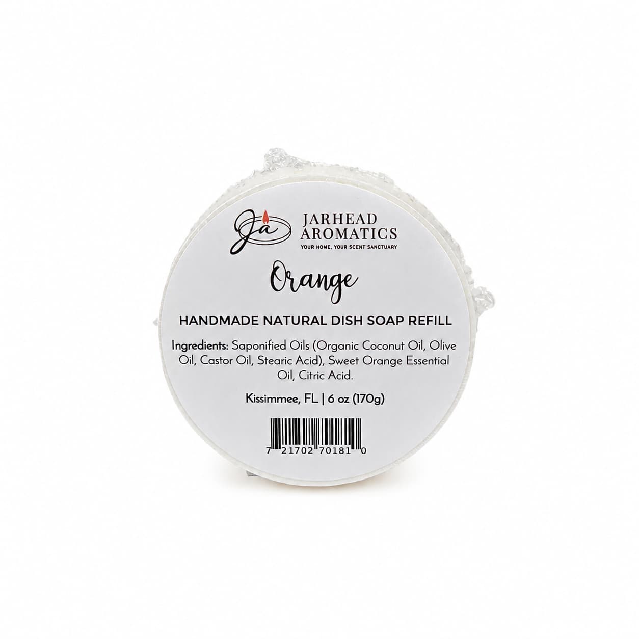 Round white soap bar labeled Jarhead Aromatics Orange Handmade Natural Solid Dish Soap, a citrus kitchen cleaning bar with essential oils. This plant-based formula includes a detailed ingredients list, weighs 6 oz (170g), and is made in Kissimmee, FL—making it an eco-friendly kitchen essential.