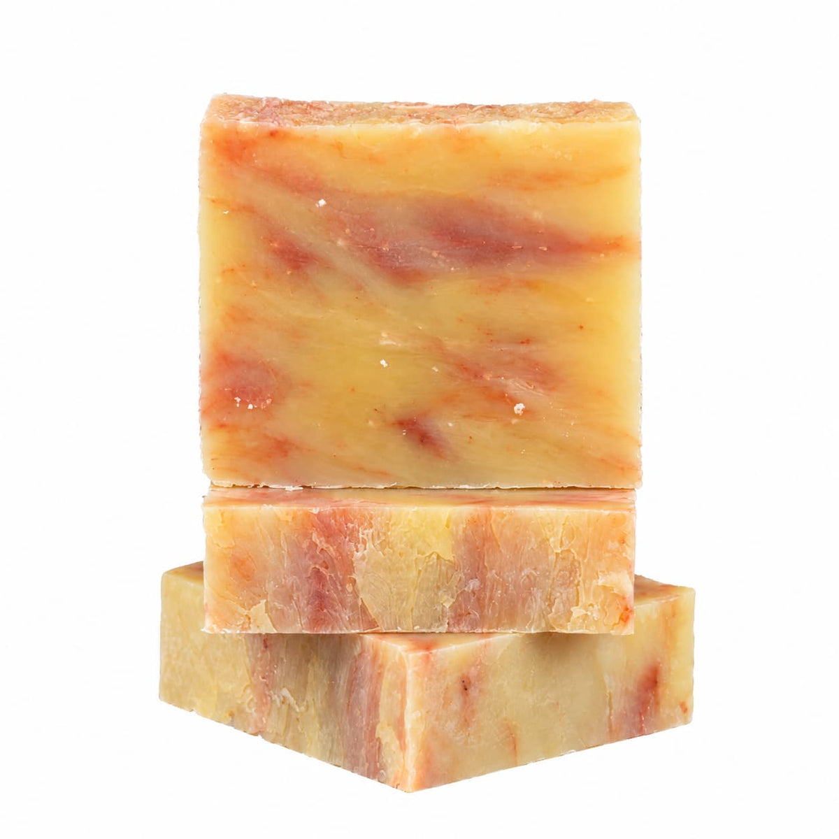 Three rectangular bars of Orange + Lime Natural Handmade Soap with orange and red marbling stacked vertically.