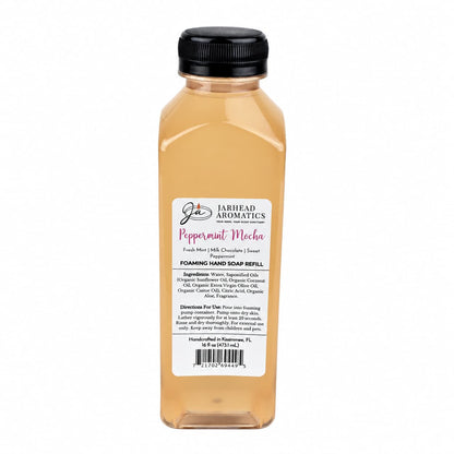 Clear plastic bottle of Jarhead Aromatics Peppermint Mocha Handmade Foaming Hand Soap | Chocolate Mint & Vanilla refill with a black cap and a label detailing the scent, ingredients, and instructions.