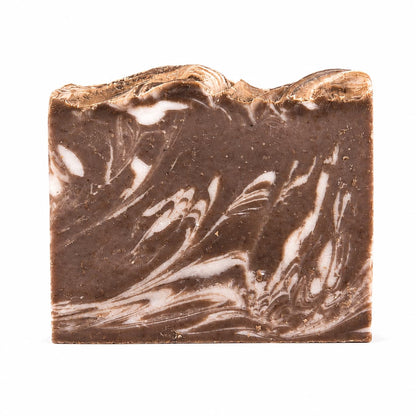 A rectangular bar of Jarhead Aromatics Porter + Coffee Handmade Craft Beer Artisan Soap, featuring brown and white marbled layers with a wavy top edge and standing upright on a white background.