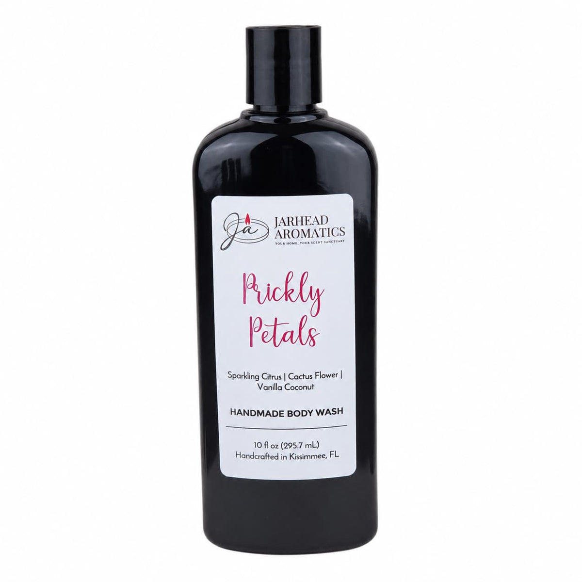 A 10 fl oz black bottle of Jarhead Aromatics Prickly Petals Handmade Body Wash features a white label detailing scent notes of sparkling citrus, cactus flower, and vanilla coconut. This moisturizing body wash is crafted with organic aloe and plant-based oils.