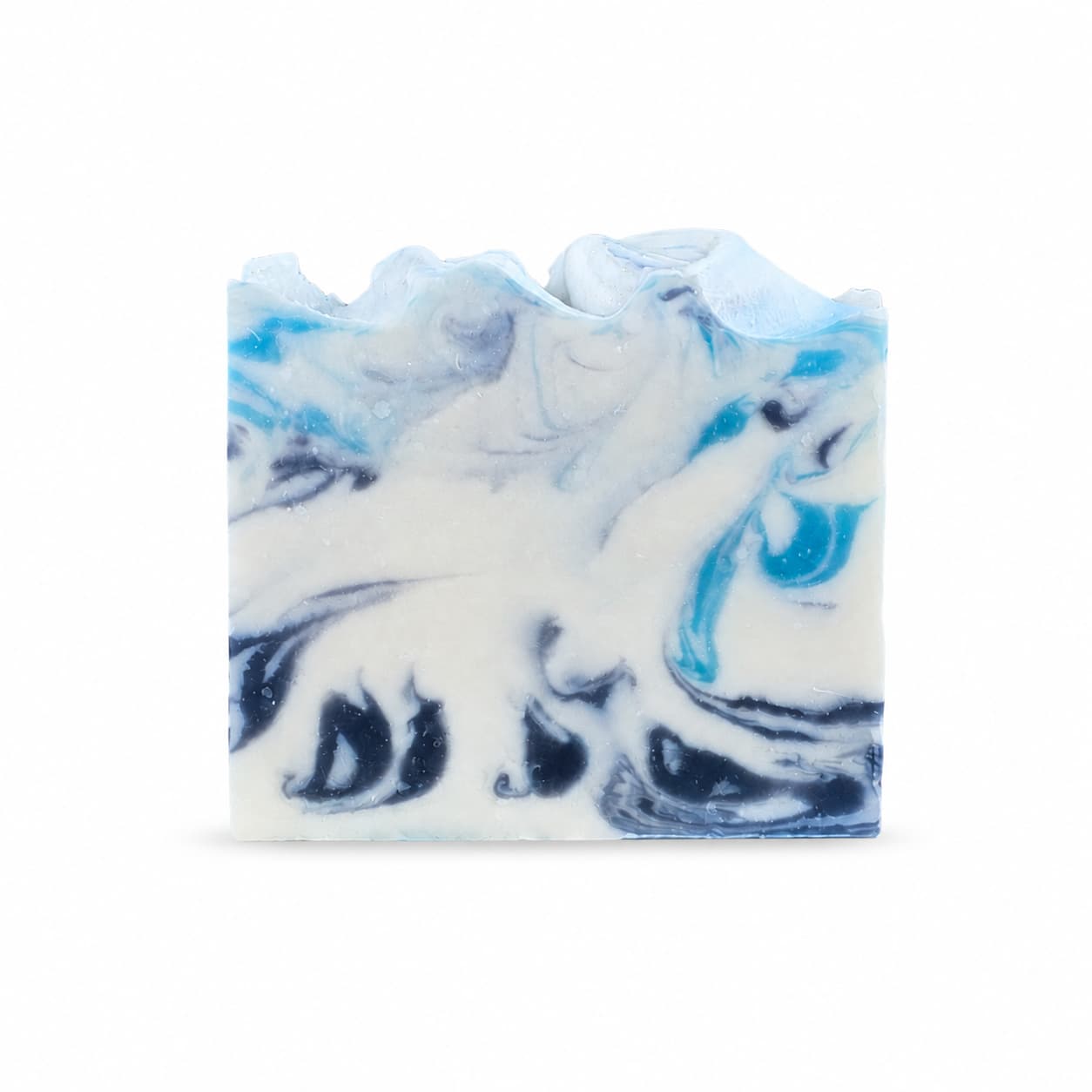 A rectangular bar of Rosemary + Eucalyptus Handmade Coconut Milk Artisan Soap by Jarhead Aromatics, featuring swirling blue, navy, and white patterns reminiscent of ocean waves, displayed against a plain white background.