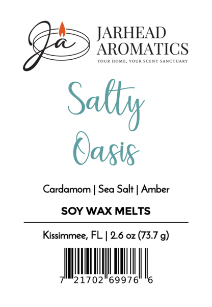 Label for Salty Oasis Soy Wax Melt | Sea Salt Amber & Coastal Spa Wax Melts by Jarhead Aromatics, with sea salt, amber, marine notes & cardamom. Includes logo, Kissimmee FL location, weight 2.6 oz/73.7g & barcode at bottom.