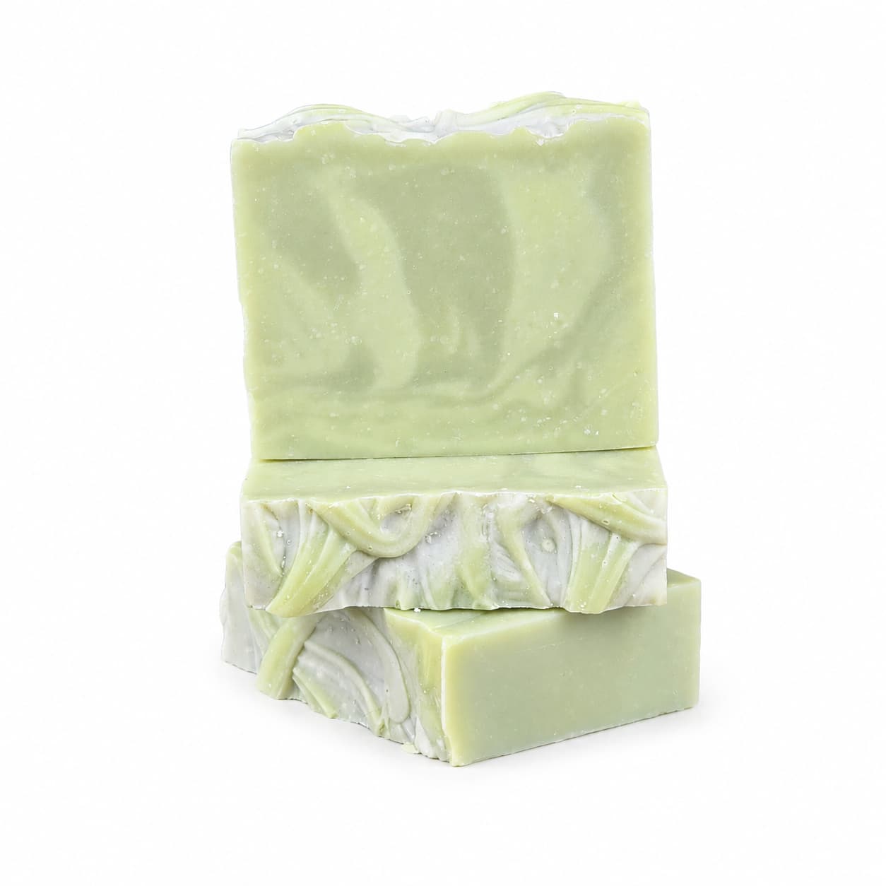 Three bars of Jarhead Aromatics’ Sea Kelp + Aloe Handmade Natural Goat Milk Artisan Soap are displayed against a plain white background—two light green, rectangular bars stacked with a third leaning alongside them. Each soap bar features a marbled, wavy pattern of white and green that evokes luxurious marine botanicals, highlighting the cooling mint and sea kelp ingredients.