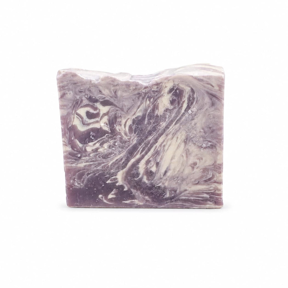 A rectangular bar of Sugar Plum Handmade Coconut Milk Artisan Soap with a purple and white marbled sugar plum pattern.
