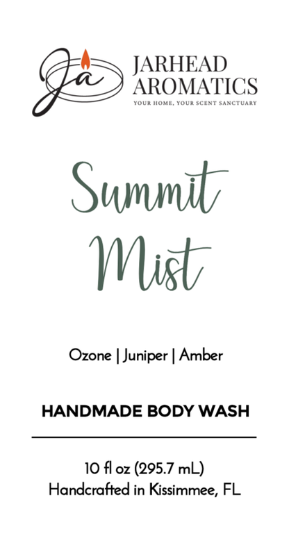 Jarhead Aromatics Summit Mist Handmade Body Wash, 10 fl oz (295.7 mL). Features moisturizing organic aloe & plant-based oils with ozone, juniper & amber scent notes. Handcrafted in Kissimmee, FL. Black and green logo/text on white background.