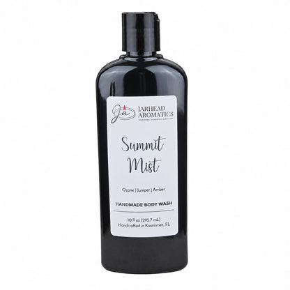A black bottle of Jarhead Aromatics Summit Mist Handmade Body Wash, featuring scents of ozone, juniper, and amber. This 10 fl oz moisturizing wash is crafted with organic aloe and plant-based oils in Kasimere, FL.