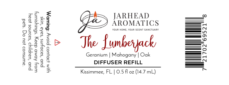 White product label for Jarhead Aromatics The Lumberjack Cold Air Diffuser Refill | Mahogany & Cedarwood, featuring a rich blend of mahogany, cedarwood, and geranium. Warning: avoid eye contact; keep from children and pets. Size: 0.5 fl oz.
