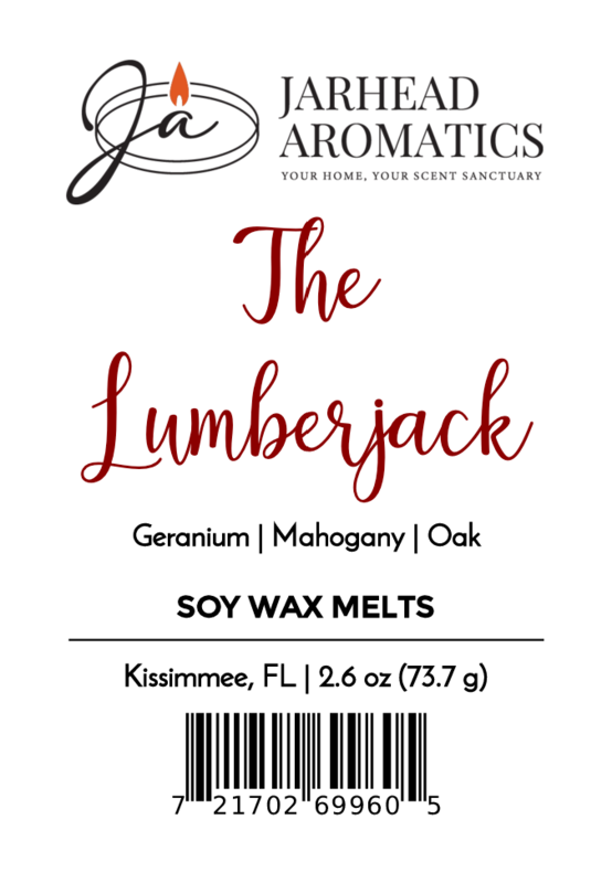 Label for Jarhead Aromatics' The Lumberjack Soy Wax Melt | Mahogany Cedar & Oak, hand-poured soy wax melts with woodsy scent. Includes logo, 2.6 oz/73.7g, barcode. Made in Kissimmee, FL.