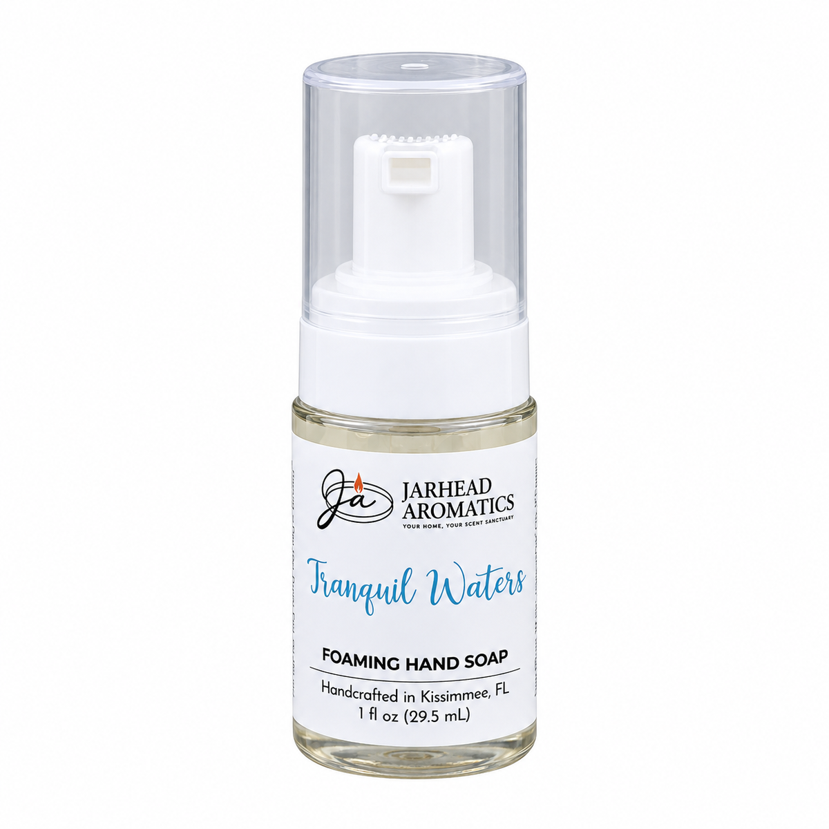 A small clear plastic bottle of Tranquil Waters Handmade Foaming Hand Soap with a white pump dispenser and a clear cap.