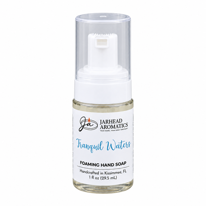 A small clear plastic bottle of Tranquil Waters Handmade Foaming Hand Soap with a white pump dispenser and a clear cap.