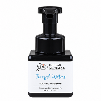 A square, black Jarhead Aromatics Tranquil Waters Handmade Foaming Hand Soap dispenser with a white label featuring blue text.