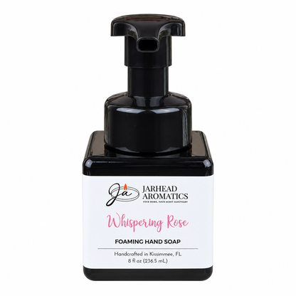 Square black bottle of Whispering Rose Handmade Foaming Hand Soap by Jarhead Aromatics, featuring a black pump dispenser and a white label with the brand name.