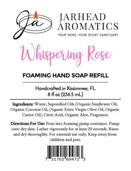 Label for Jarhead Aromatics Whispering Rose Foaming Hand Soap, 8 fl oz. Made with plant-based oils and coastal fragrance. Features ingredients, usage directions, barcode, and branding. Handcrafted in Kissimmee, FL.