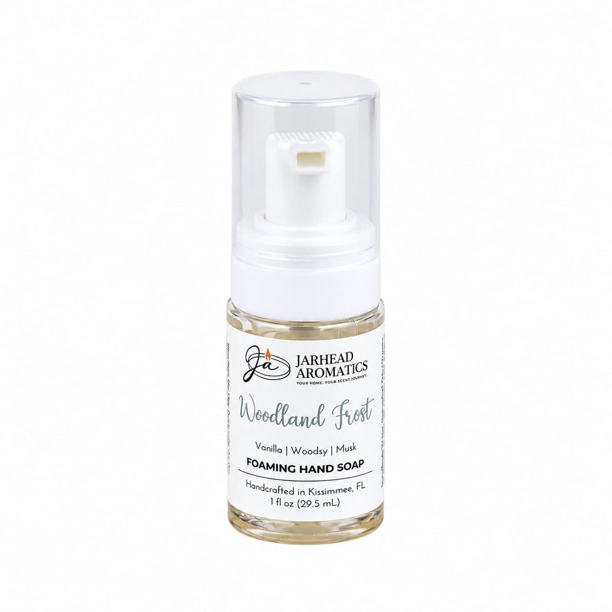 Small clear bottle of Woodland Frost Handmade Foaming Hand Soap | Vanilla, Lavender & Woodsy Musk with a white pump dispenser and a winter-inspired label.