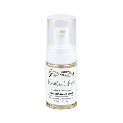Small clear bottle of Woodland Frost Handmade Foaming Hand Soap | Vanilla, Lavender & Woodsy Musk with a white pump dispenser and a winter-inspired label.