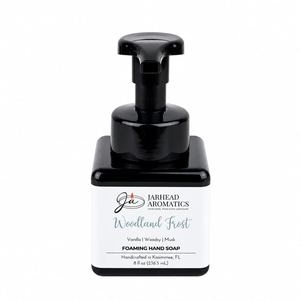 A square black bottle of Jarhead Aromatics Woodland Frost Handmade Foaming Hand Soap, featuring a black pump dispenser and a white label.