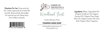 Product label for Woodland Frost Handmade Foaming Hand Soap, featuring vanilla, lavender, and woodsy musk scent notes, with an ingredient list, usage directions, and a barcode.