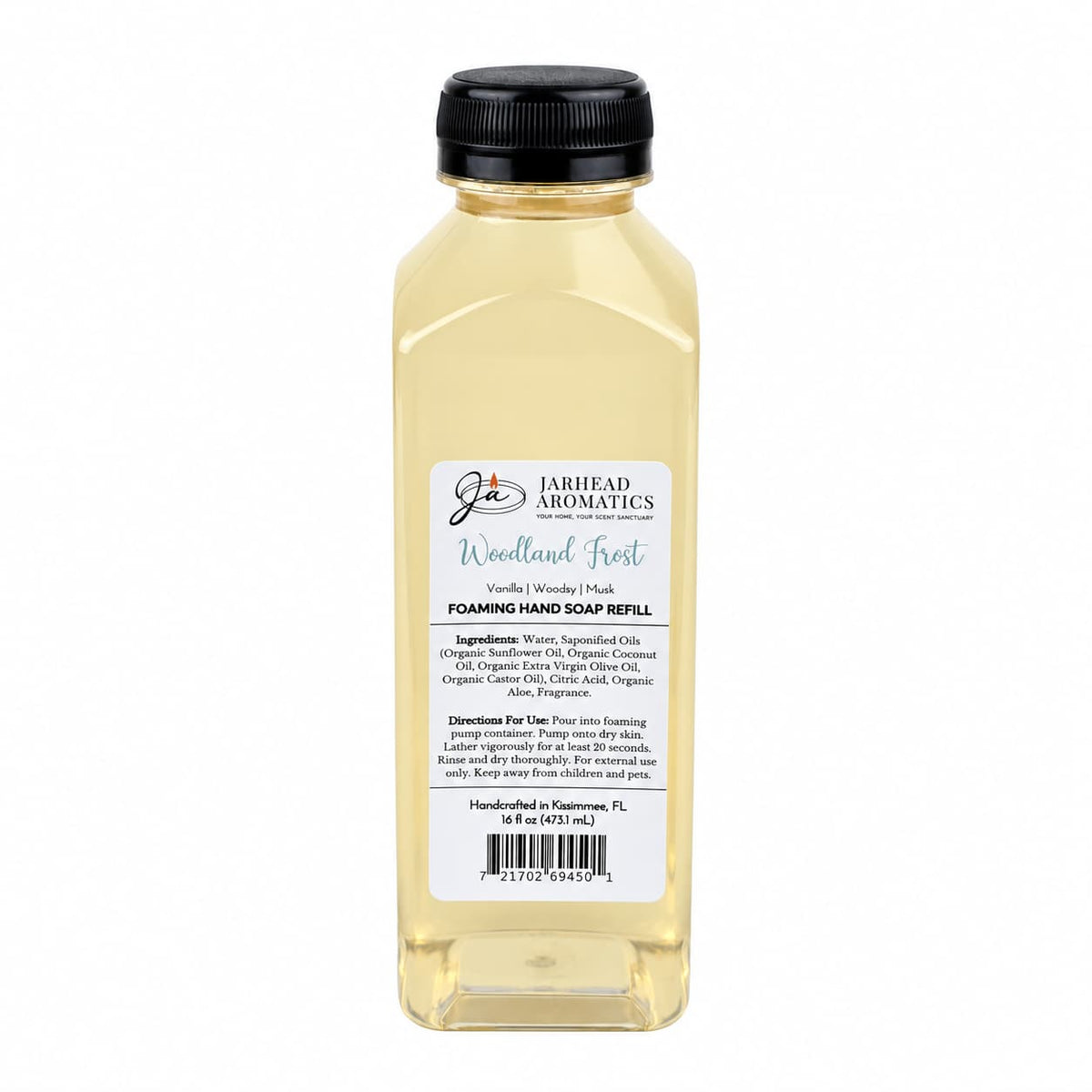 Clear plastic bottle of Woodland Frost Handmade Foaming Hand Soap | Vanilla, Lavender & Woodsy Musk with a black cap and a rectangular label detailing ingredients, directions, and a barcode.