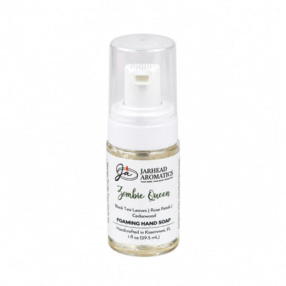 Small travel-size pump bottle of Jarhead Aromatics Zombie Queen Handmade Foaming Hand Soap, featuring notes of black tea, rose petals, and cedarwood.