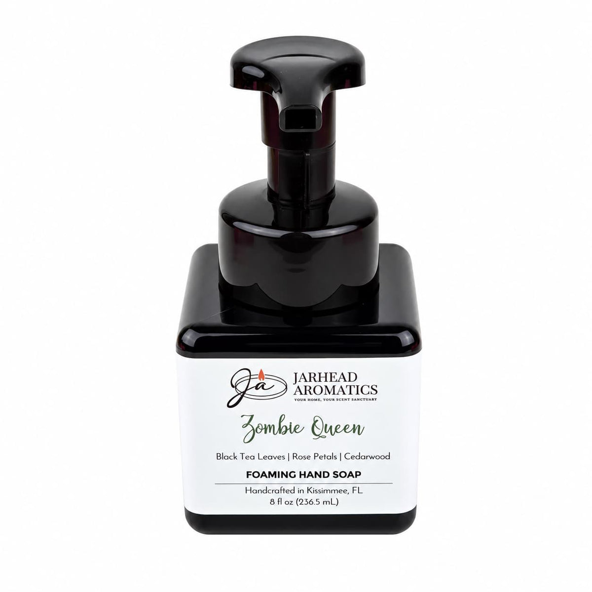 Square black bottle of Zombie Queen Handmade Foaming Hand Soap with a pump dispenser and a label featuring the scent profile of black tea, rose petals, and cedarwood.