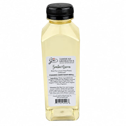 A clear plastic refill bottle of Zombie Queen Handmade Foaming Hand Soap | Black Tea, Rose Petals & Cedarwood, featuring a black cap and a label detailing ingredients and directions.