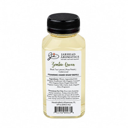 Clear plastic bottle of Zombie Queen Handmade Foaming Hand Soap | Black Tea, Rose Petals & Cedarwood with a black pump cap and a label detailing ingredients, directions, and scent notes.